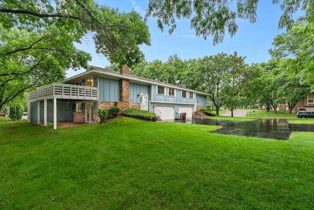 6881 Stratford Rd, Woodbury, MN 55125 - back of house featuring board and batten siding, a garage, a chimney, a lawn, and a deck