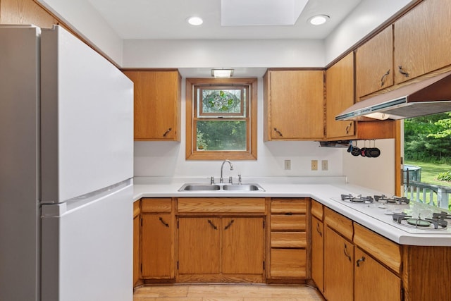 20240 Saint Croix Trl N, Scandia, MN 55073 - kitchen with white appliances, light countertops, plenty of natural light, and light wood-style flooring