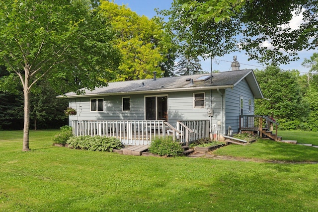 20240 Saint Croix Trl N, Scandia, MN 55073 - back of property featuring a yard, a chimney, and a wooden deck