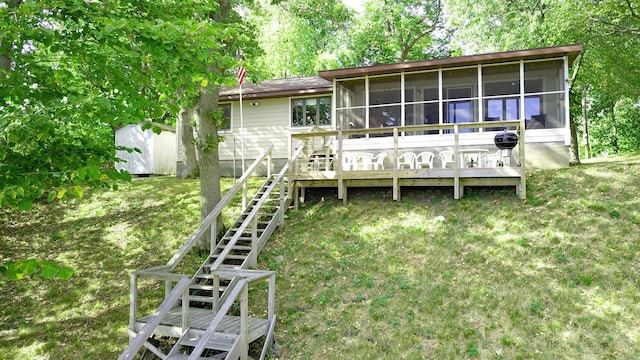 20758 Pike Ave, Aitkin, MN 56431 - back of house with a sunroom, stairway, a deck, and a yard