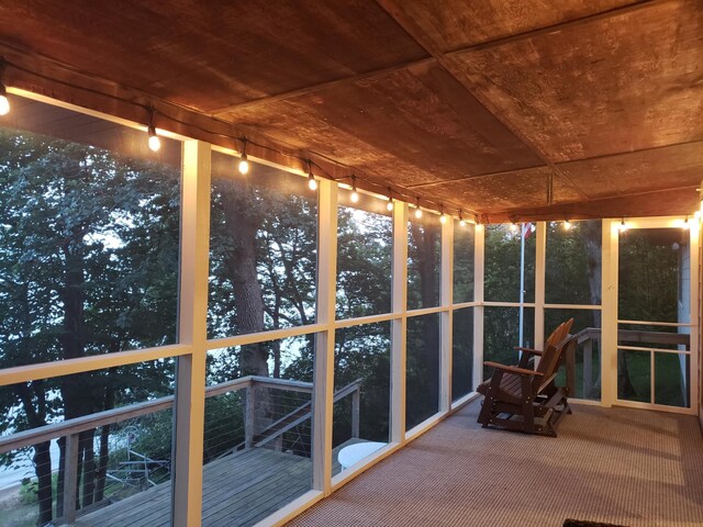 20758 Pike Ave, Aitkin, MN 56431 - unfurnished sunroom with carpet flooring, wood ceiling, and rail lighting