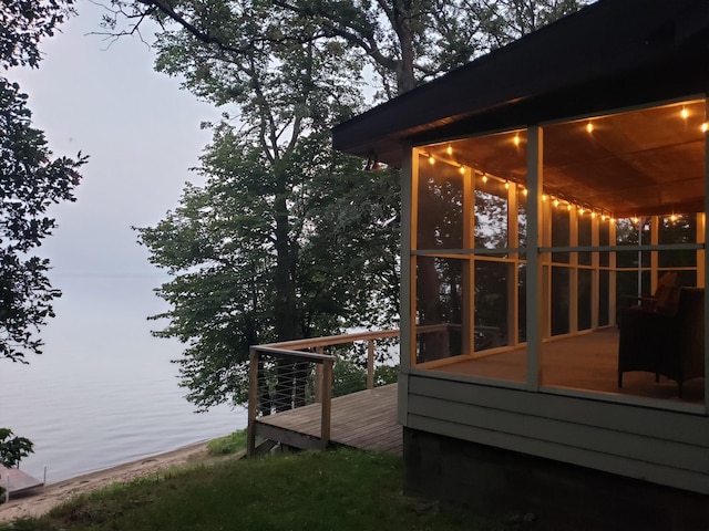 20758 Pike Ave, Aitkin, MN 56431 - wooden deck featuring a sunroom