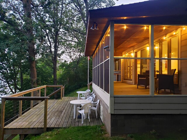 20758 Pike Ave, Aitkin, MN 56431 - wooden terrace featuring a sunroom