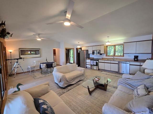 20758 Pike Ave, Aitkin, MN 56431 - living area with light wood-style flooring, vaulted ceiling, and a ceiling fan