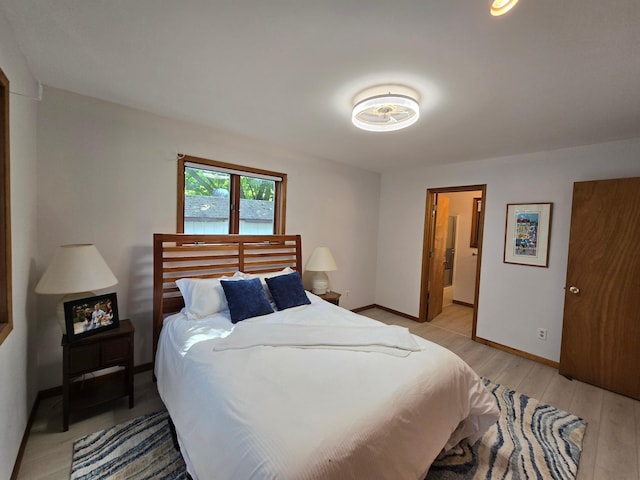 20758 Pike Ave, Aitkin, MN 56431 - bedroom featuring light wood-type flooring and ensuite bathroom