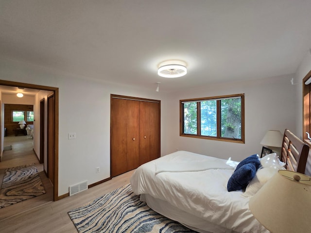 20758 Pike Ave, Aitkin, MN 56431 - bedroom featuring light wood-style floors and a closet