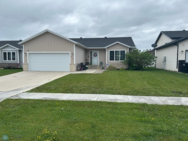 959 29th Ave W, West Fargo, ND 58078 - ranch-style house featuring an attached garage, board and batten siding, concrete driveway, a front yard, and brick siding