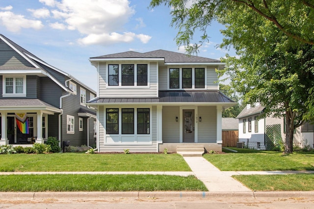 2084 Palace Ave, Saint Paul, MN 55105 - view of front of property with covered porch, a standing seam roof, a metal roof, and a front lawn