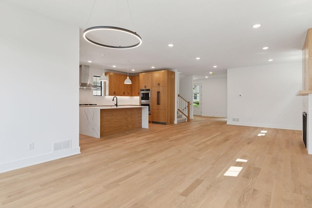2084 Palace Ave, Saint Paul, MN 55105 - unfurnished living room featuring recessed lighting, light wood finished floors, a fireplace, and stairs