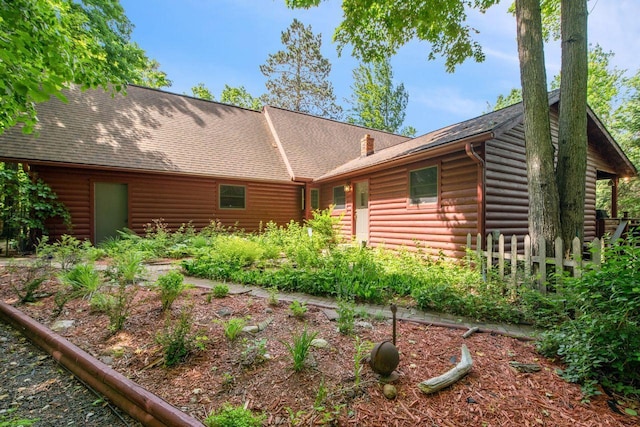 62405 Delta Lake Rd, Delta, WI 54847 - rear view of property featuring roof with shingles and faux log siding