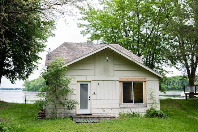 17700 78th St SW, Cokato, MN 55321 - view of front of house with a front yard, a water view, and roof with shingles