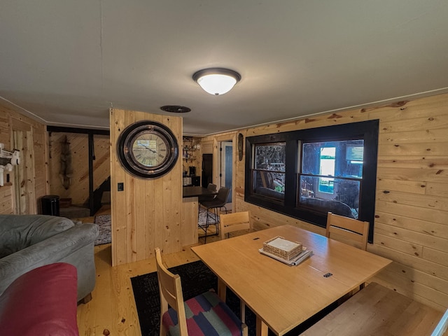 17700 78th St SW, Cokato, MN 55321 - dining room featuring wooden walls, wood finished floors, and a desk