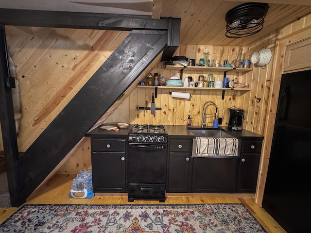 17700 78th St SW, Cokato, MN 55321 - bar area with black gas range, wood walls, and light wood finished floors