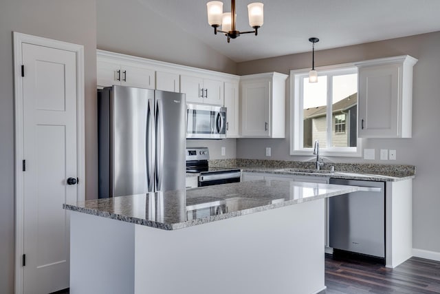 17360 62nd St NE, Otsego, MN 55330 - kitchen with stainless steel appliances, dark wood-style floors, a center island, white cabinetry, and a chandelier