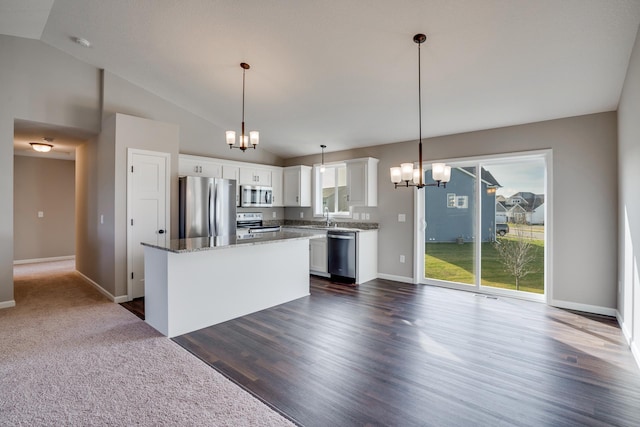 17360 62nd St NE, Otsego, MN 55330 - kitchen featuring appliances with stainless steel finishes, a chandelier, lofted ceiling, white cabinets, and a kitchen island