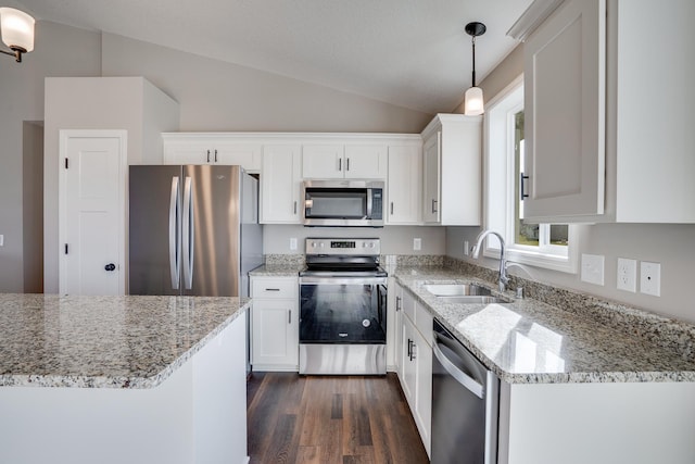 17360 62nd St NE, Otsego, MN 55330 - kitchen featuring stainless steel appliances, lofted ceiling, dark wood-style floors, white cabinets, and decorative light fixtures