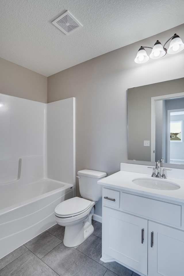 17360 62nd St NE, Otsego, MN 55330 - bathroom featuring vanity,  shower combination, tile patterned flooring, and a textured ceiling