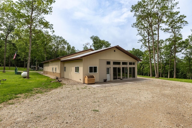 9005 80th Ave SE, Orion Twp, MN 55923 - rear view of house with a lawn