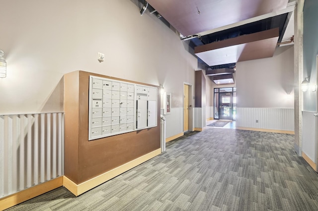 918 3rd St N Unit 210, Minneapolis, MN 55401 - hallway featuring mail area, carpet flooring, and wainscoting