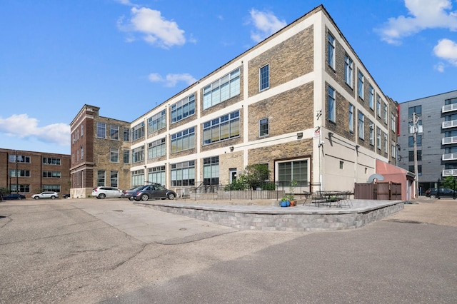 918 3rd St N Unit 210, Minneapolis, MN 55401 - view of apartment building / complex with uncovered parking