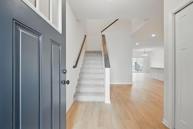 6570 Jody Ave S, Cottage Grove, MN 55016 - foyer entrance with light wood-type flooring, recessed lighting, stairs, and a chandelier