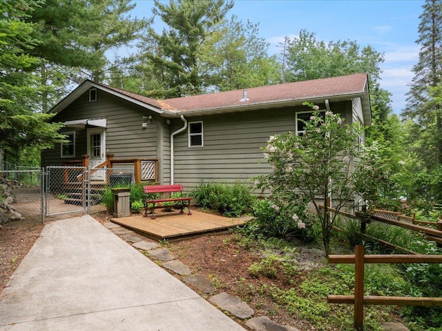 33277 308th Ln, Aitkin, MN 56431 - back of house with a gate and a deck