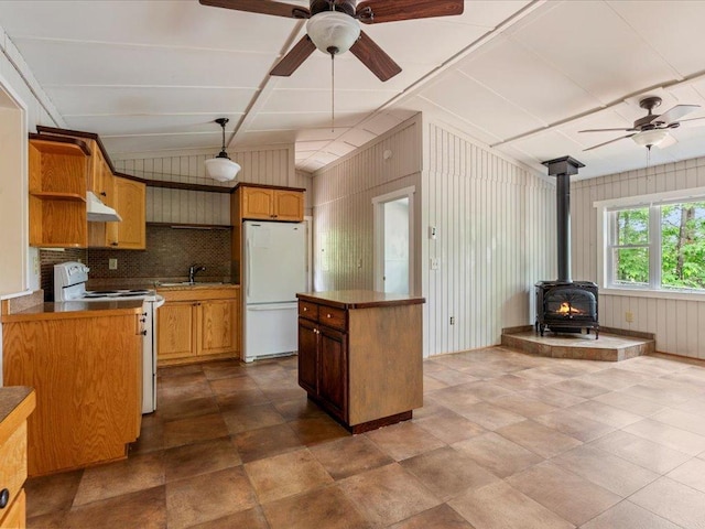 33277 308th Ln, Aitkin, MN 56431 - kitchen featuring white appliances, a ceiling fan, under cabinet range hood, a wood stove, and open shelves