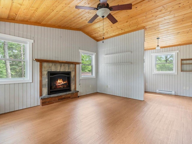 33277 308th Ln, Aitkin, MN 56431 - unfurnished living room with a baseboard radiator, wood finished floors, vaulted ceiling, a tile fireplace, and wood ceiling