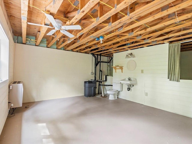 33277 308th Ln, Aitkin, MN 56431 - garage featuring a ceiling fan and concrete block wall