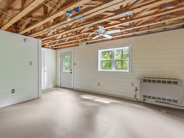 33277 308th Ln, Aitkin, MN 56431 - garage with heating unit, wooden walls, and ceiling fan