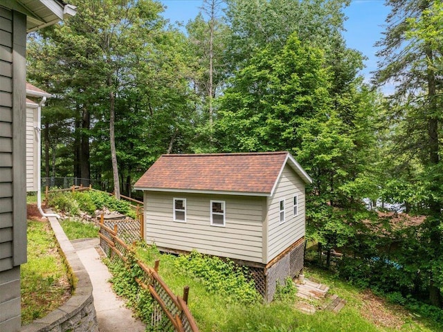 33277 308th Ln, Aitkin, MN 56431 - view of side of home with an outdoor structure and roof with shingles