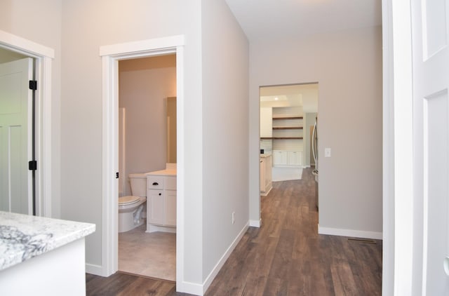 21705 Willys St NE, East Bethel, MN 55011 - hallway with dark wood finished floors and baseboards