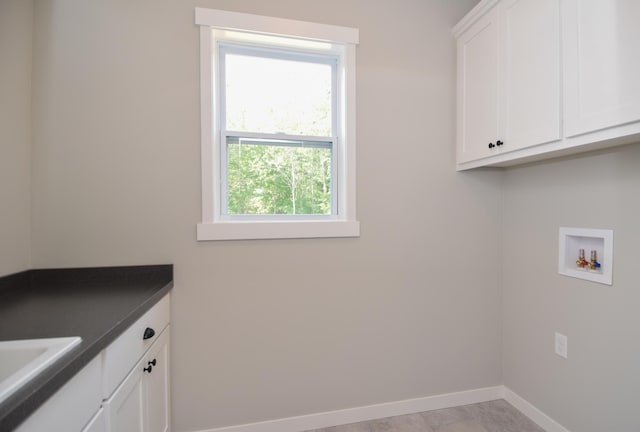 21705 Willys St NE, East Bethel, MN 55011 - laundry room featuring cabinet space and washer hookup