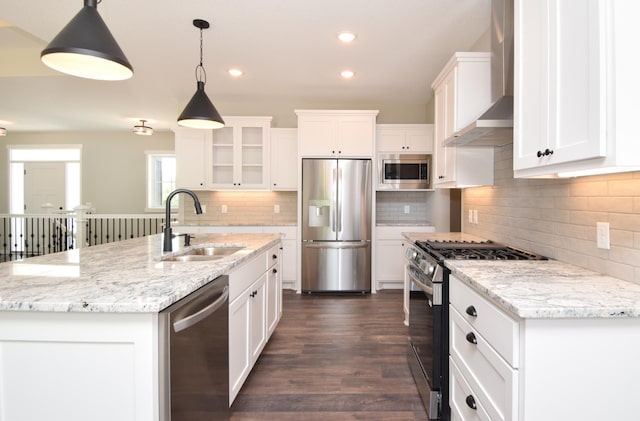 21705 Willys St NE, East Bethel, MN 55011 - kitchen featuring stainless steel appliances, wall chimney exhaust hood, recessed lighting, white cabinets, and backsplash
