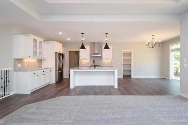 21705 Willys St NE, East Bethel, MN 55011 - kitchen featuring stainless steel refrigerator with ice dispenser, wall chimney range hood, decorative backsplash, dark wood finished floors, and recessed lighting