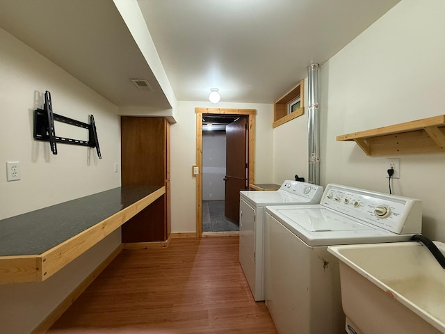 2161 Cardinal Ln, Mound, MN 55364 - laundry room with separate washer and dryer and wood finished floors