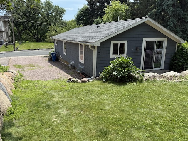 2161 Cardinal Ln, Mound, MN 55364 - rear view of house featuring roof with shingles and a lawn