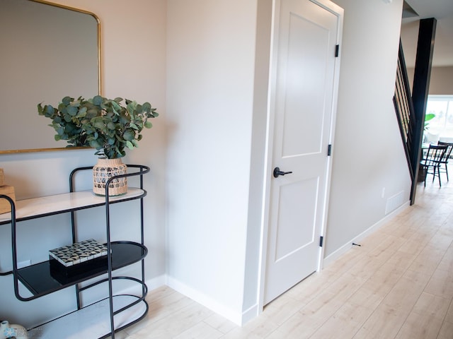 1479 66th Ave S, Fargo, ND 58104 - corridor featuring light wood-style flooring and baseboards