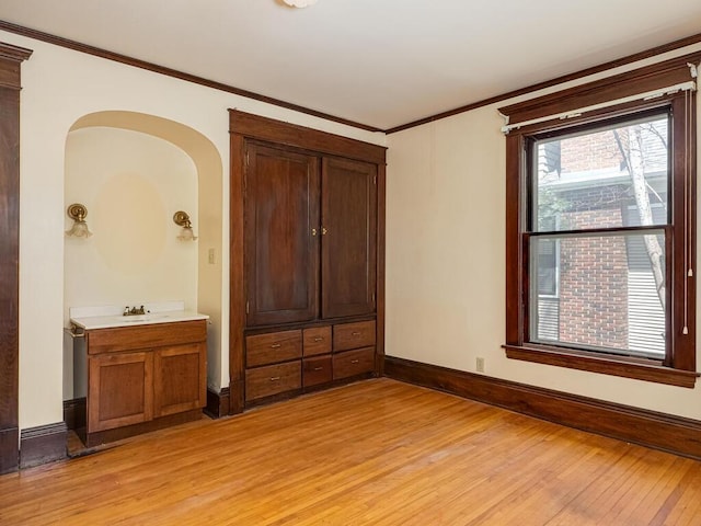 2320 Humboldt Ave S, Minneapolis, MN 55405 - unfurnished bedroom featuring light wood-style flooring and crown molding