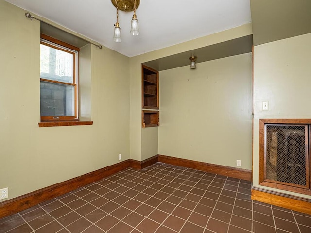 2320 Humboldt Ave S, Minneapolis, MN 55405 - empty room featuring dark tile patterned floors and baseboards