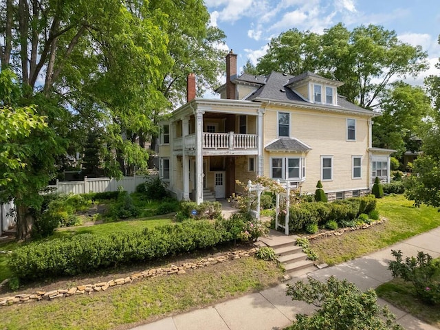 2320 Humboldt Ave S, Minneapolis, MN 55405 - view of front of house with a balcony and a chimney