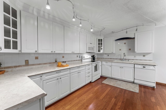 2485 Canabury Dr Unit 112, Little Canada, MN 55117 - kitchen featuring white appliances, white cabinets, light countertops, tasteful backsplash, and a textured ceiling