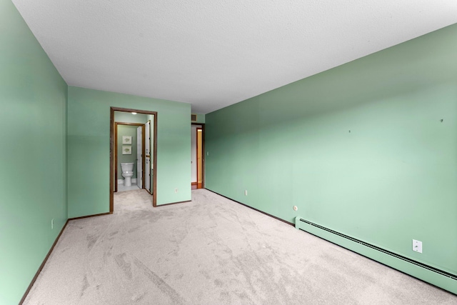 2485 Canabury Dr Unit 112, Little Canada, MN 55117 - unfurnished bedroom featuring baseboard heating, light carpet, and connected bathroom