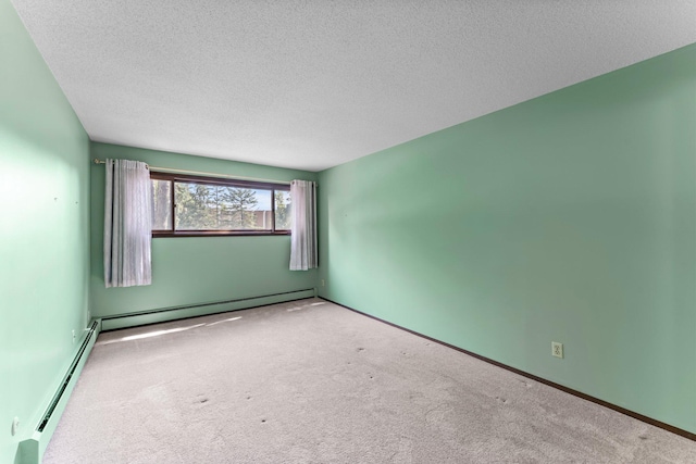 2485 Canabury Dr Unit 112, Little Canada, MN 55117 - spare room with a baseboard heating unit, carpet floors, and a textured ceiling