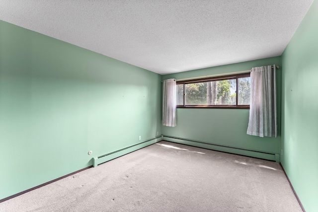 2485 Canabury Dr Unit 112, Little Canada, MN 55117 - carpeted spare room featuring a textured ceiling and a baseboard heating unit