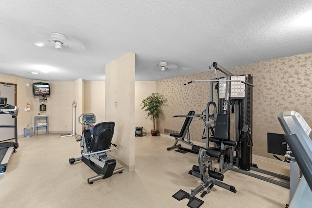 2485 Canabury Dr Unit 112, Little Canada, MN 55117 - exercise room with wallpapered walls and a textured ceiling