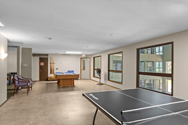 2485 Canabury Dr Unit 112, Little Canada, MN 55117 - recreation room featuring pool table, a textured ceiling, and light floors