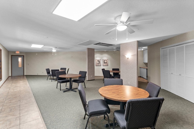 2485 Canabury Dr Unit 112, Little Canada, MN 55117 - dining area with a ceiling fan, light carpet, a textured ceiling, and light tile patterned floors