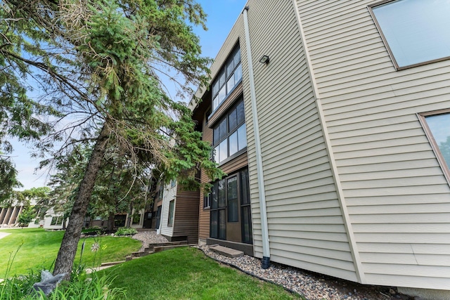 2485 Canabury Dr Unit 112, Little Canada, MN 55117 - view of home's exterior with a yard
