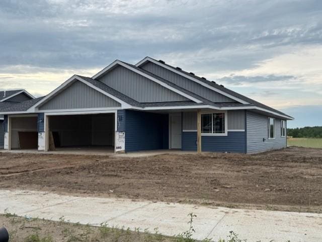 7238 Hawthorne Ct, North Branch, MN 55056 - view of front of home featuring a garage, driveway, and board and batten siding